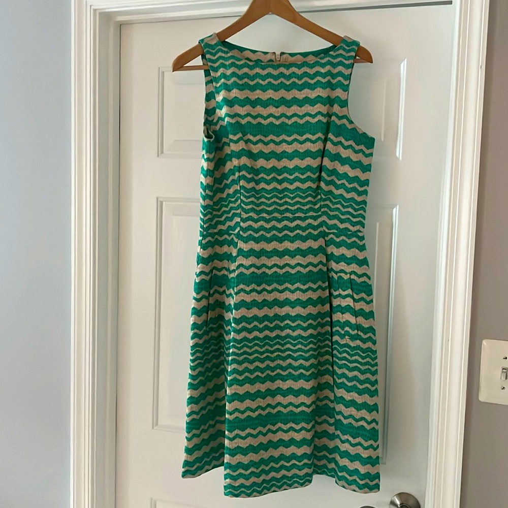 Green and beige Taylor dress.  Hits at the knee.